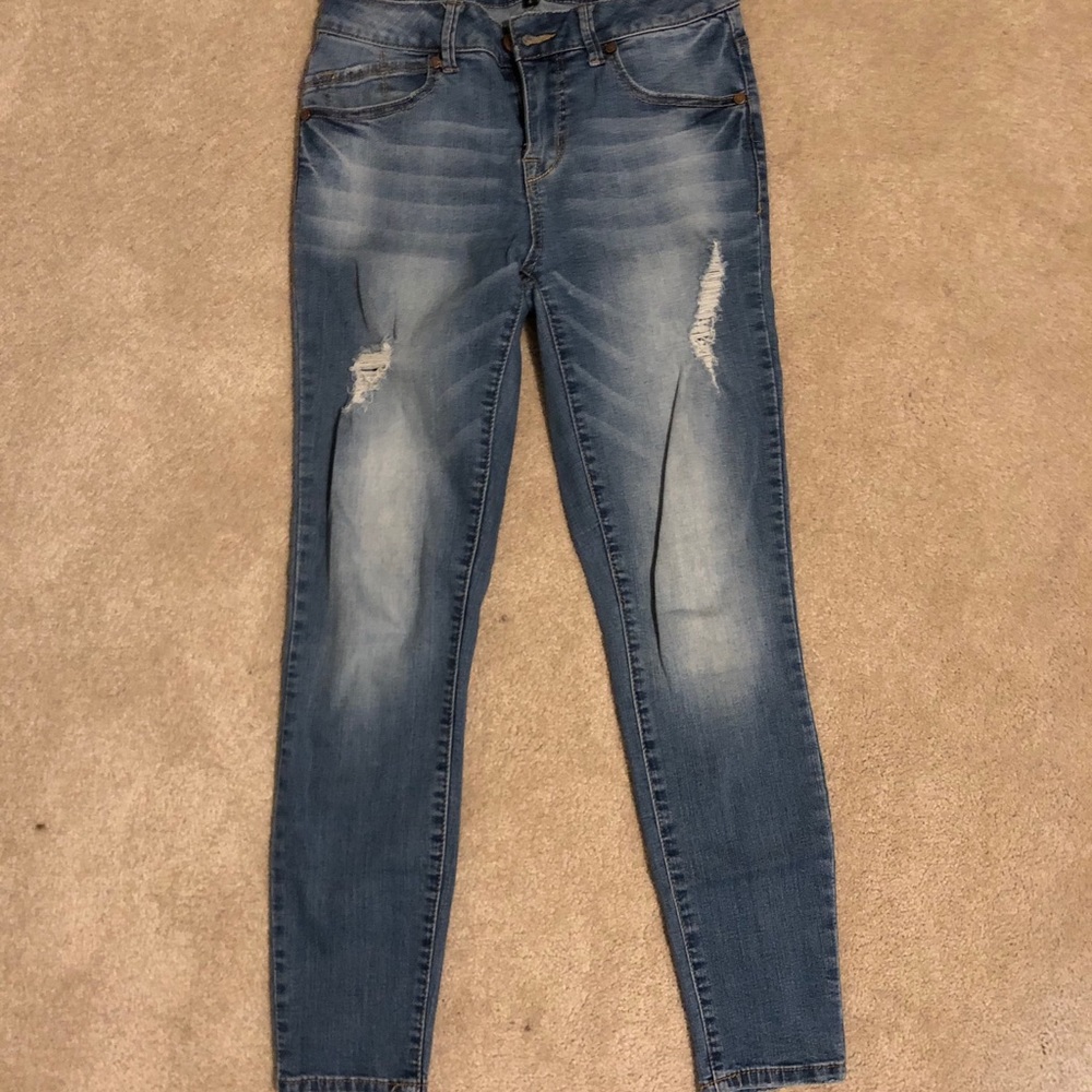 Distressed light wash denim